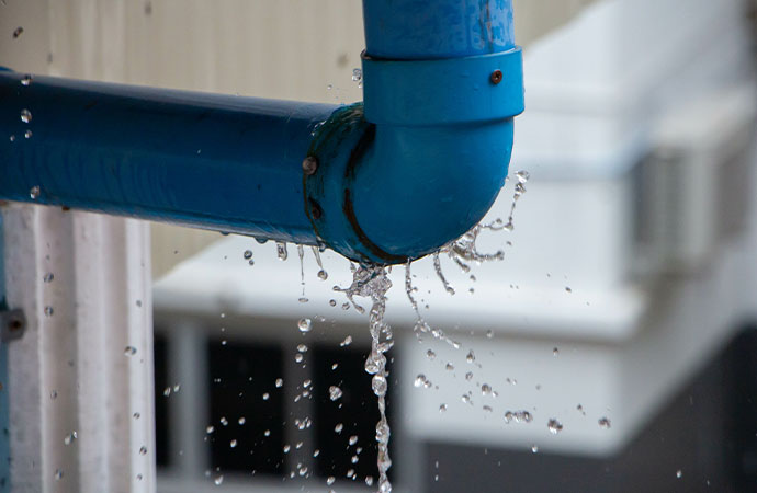 A water pipe being repaired by a plumber