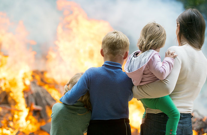 Happy family practicing fire safety tips