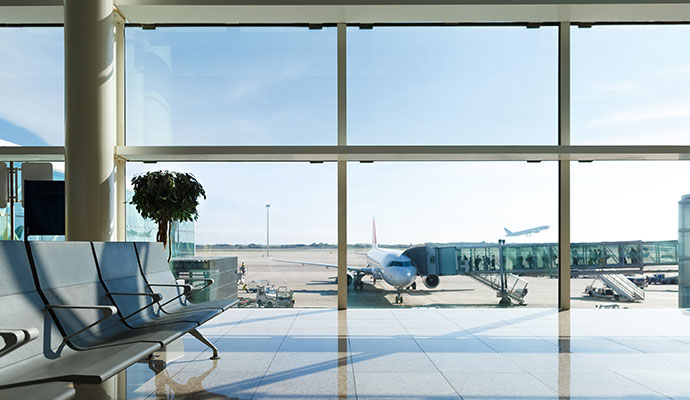 Airport terminal view with parked plane