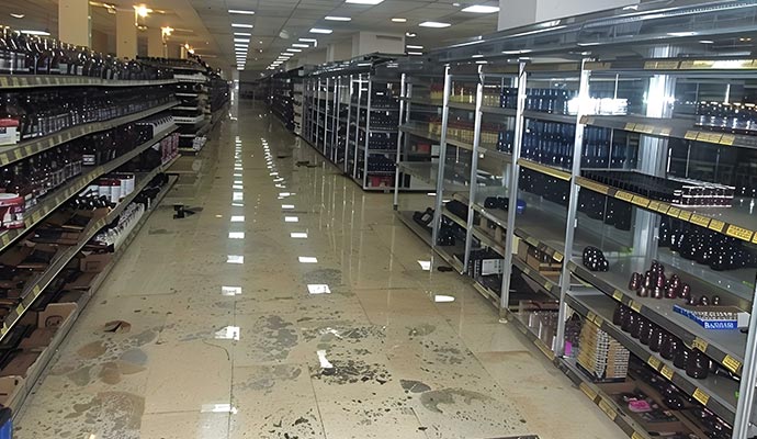 Flooded retail store Retail store aisle with standing water on the floor