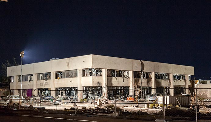 Tornado damaged healthcare facility with shattered windows Healthcare facility with shattered windows and structural damage after a severe disaster