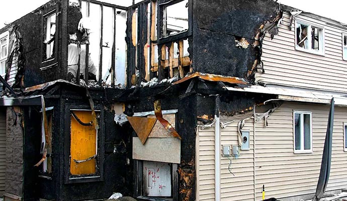 Burnt house exterior with visible fire damage