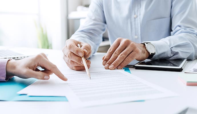 Insurance policy discussion with client Insurance agent discussing policy details with client