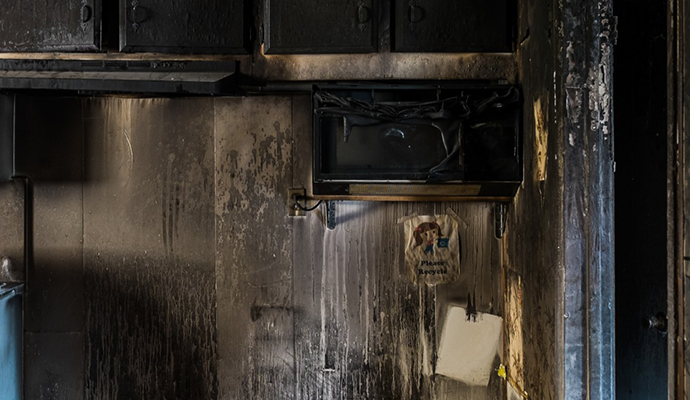 Smoke & soot damaged kitchen wall Soot and smoke damage on kitchen interior wall