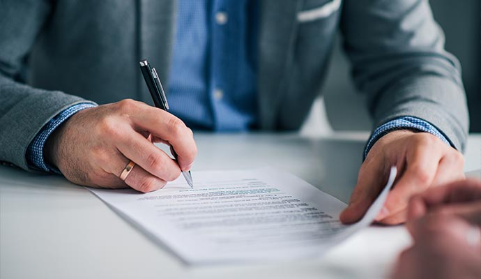 Person signing an agreement