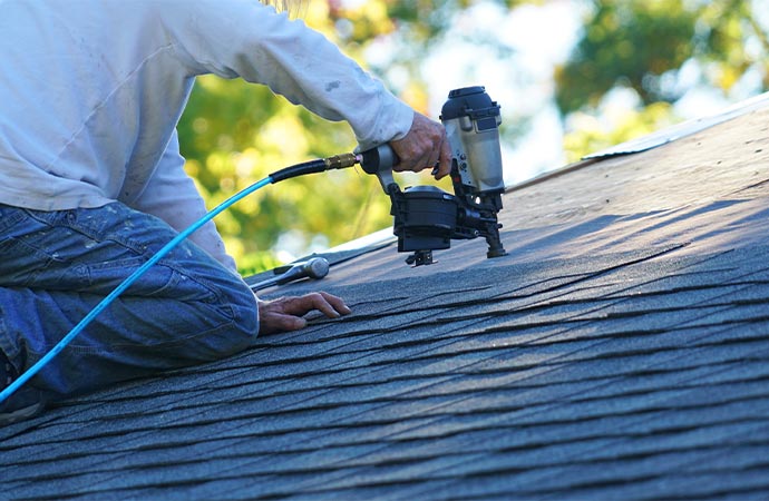 Professional worker replacing roof