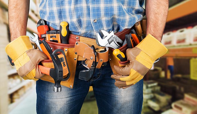 A technician wearing handyman tool belt