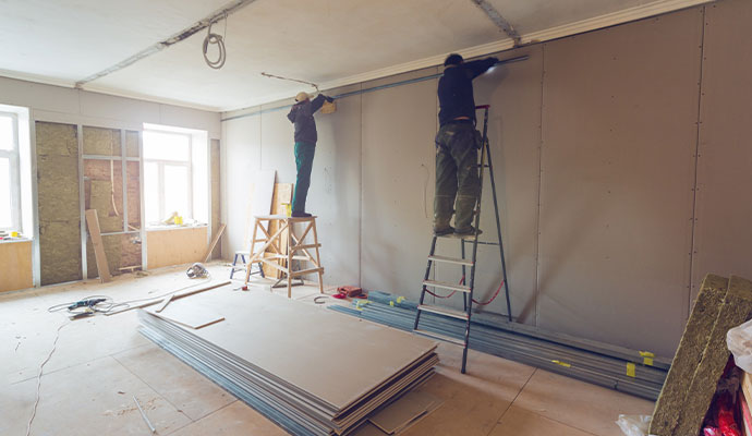 Drywall installation interior renovation workers