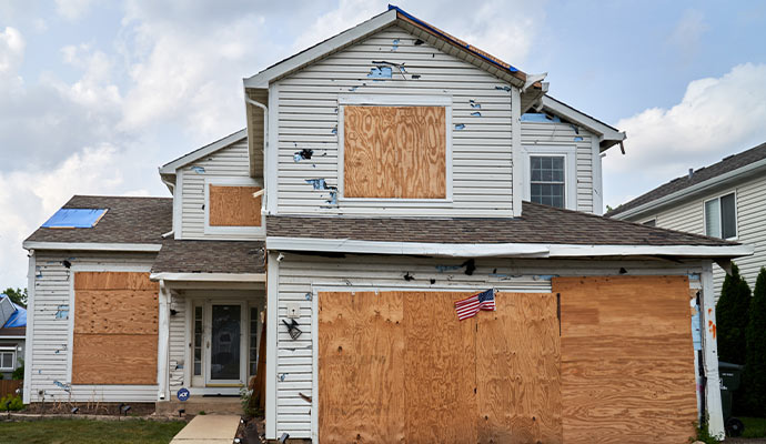 Hail damaged wood house siding