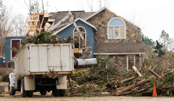 Professional team restoring a storm damaged property