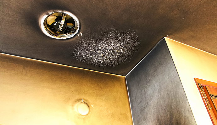 Ceiling with visible soot damage after fire
