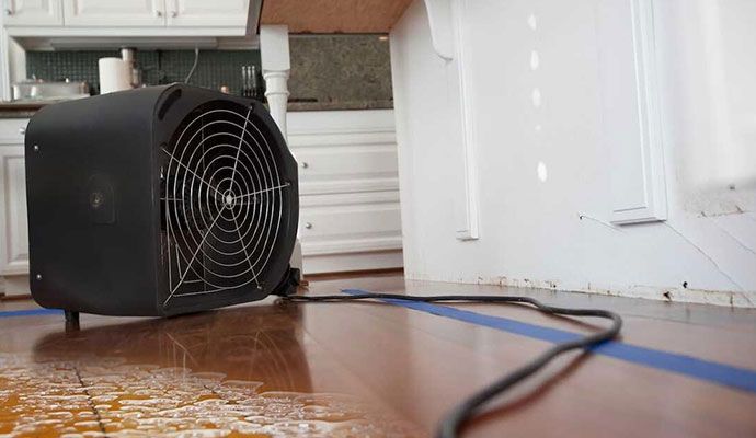 Industrial air movers drying a wet floor Industrial air movers drying a wet floor