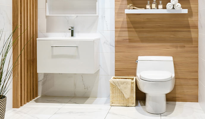 A modern bathroom with white marble floor tiles