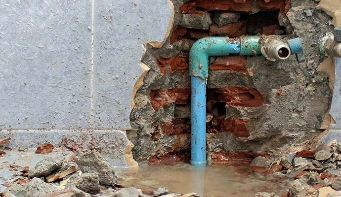 Damaged water pipe within wall