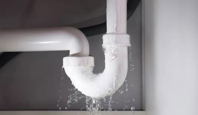 Water leaking from plumbing pipe